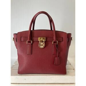 MICHAEL KORS, LARGE WINE LEATHER HANDBAG WITH LOCK CHARM.